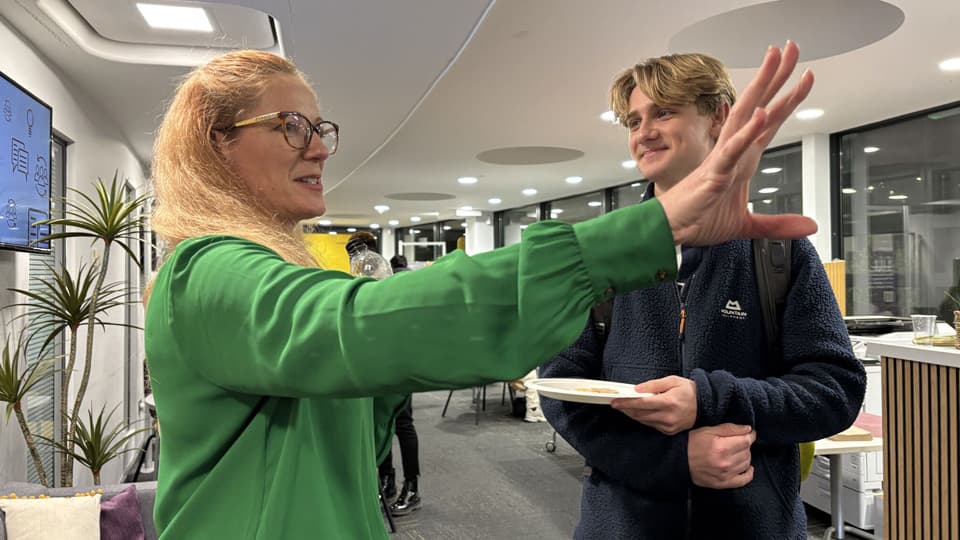 Jessie Macneil-Brown speaks with a Business School student.